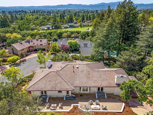 birds eye view of property with a mountain view