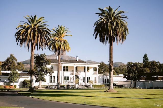 view of building exterior with a mountain view