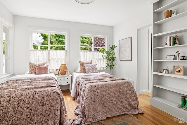 bedroom featuring light wood-style flooring