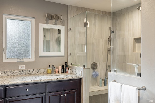 full bathroom featuring vanity and a stall shower
