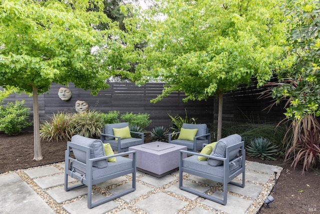 view of patio featuring fence and outdoor lounge area