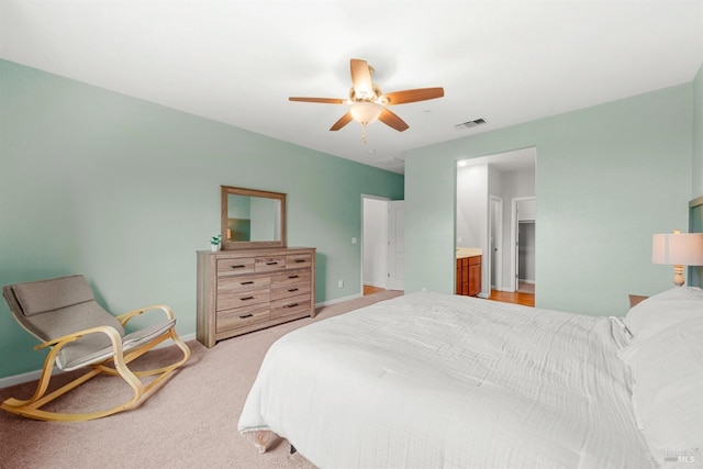bedroom with baseboards, ceiling fan, visible vents, and light colored carpet