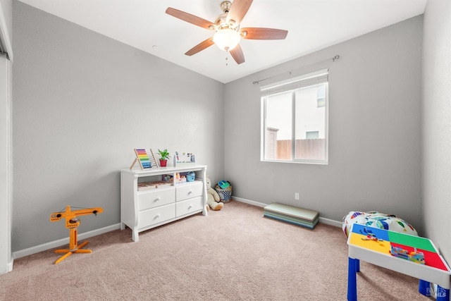 game room featuring carpet floors, ceiling fan, and baseboards