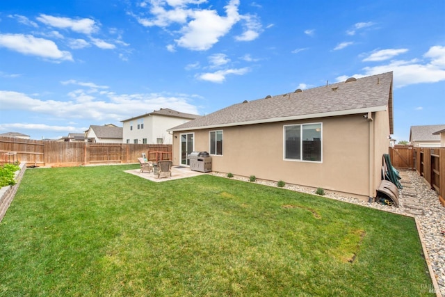 back of house featuring a patio, a fenced backyard, and a lawn