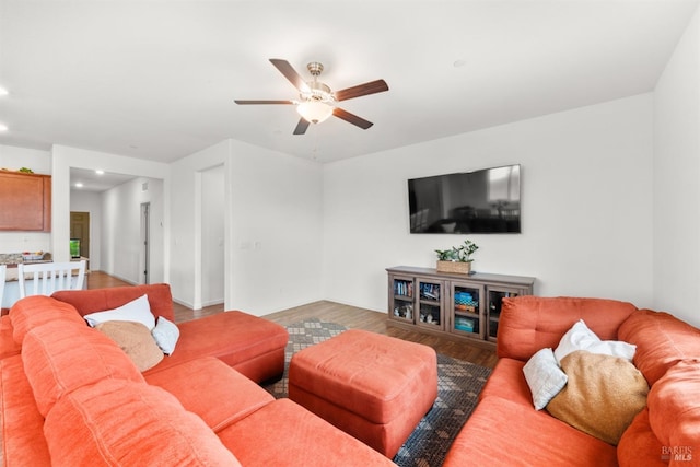 living area featuring recessed lighting, a ceiling fan, and wood finished floors