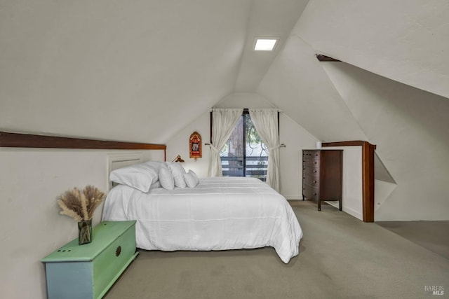 bedroom featuring lofted ceiling and carpet flooring