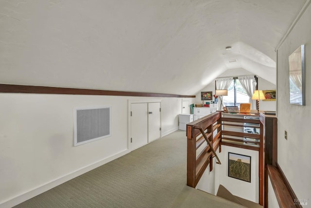 bonus room with lofted ceiling, visible vents, and carpet flooring