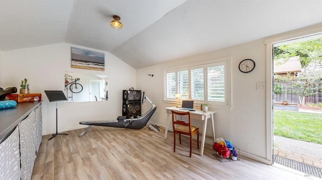 interior space featuring lofted ceiling and wood finished floors