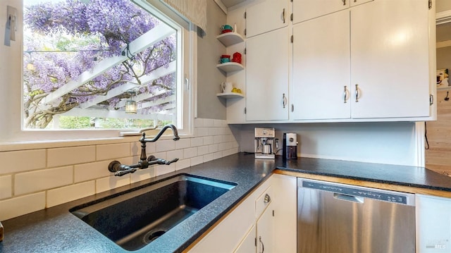 kitchen with open shelves, stainless steel dishwasher, white cabinets, and a sink