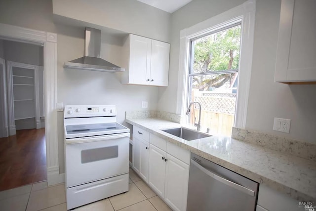 315 Baker St, Petaluma, CA 94952 - kitchen with white electric range oven, a sink, wall chimney exhaust hood, white cabinetry, and stainless steel dishwasher