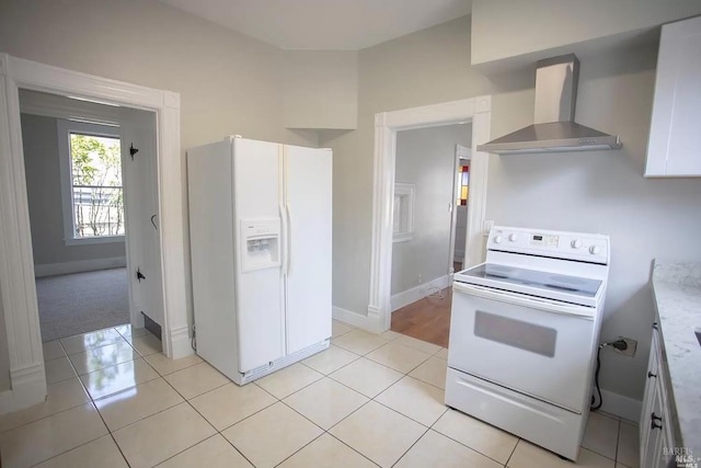 315 Baker St, Petaluma, CA 94952 - kitchen with wall chimney range hood, white appliances, light tile patterned flooring, and light countertops