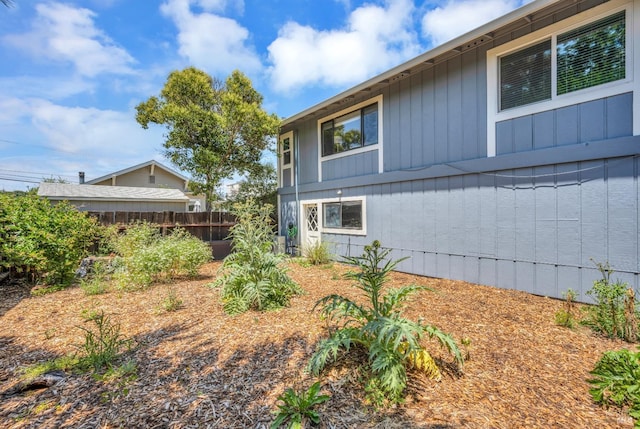 view of side of property with fence