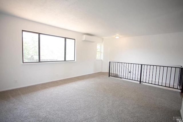 315 Baker St, Petaluma, CA 94952 - unfurnished room featuring baseboards, a wall unit AC, and carpet
