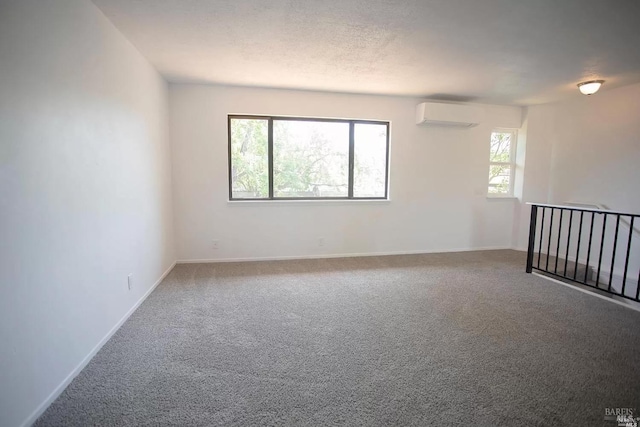 315 Baker St, Petaluma, CA 94952 - carpeted empty room featuring a wall mounted air conditioner and baseboards