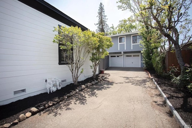 315 Baker St, Petaluma, CA 94952 - exterior space with an attached garage, fence, and aphalt driveway