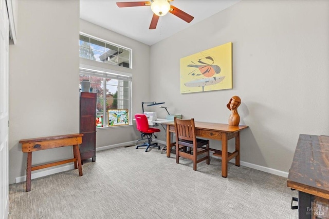 office space with baseboards, carpet flooring, and ceiling fan