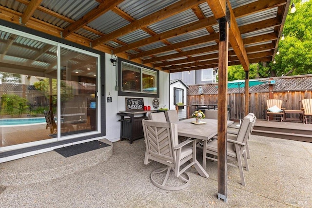 view of patio featuring a fenced in pool and fence