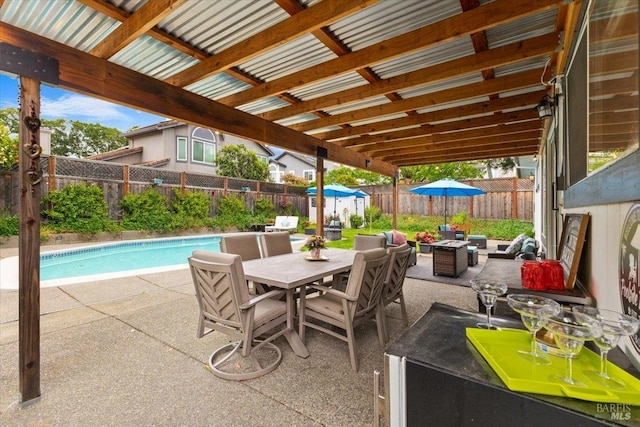 view of patio with an outdoor living space, a fenced in pool, a fenced backyard, and outdoor dining space