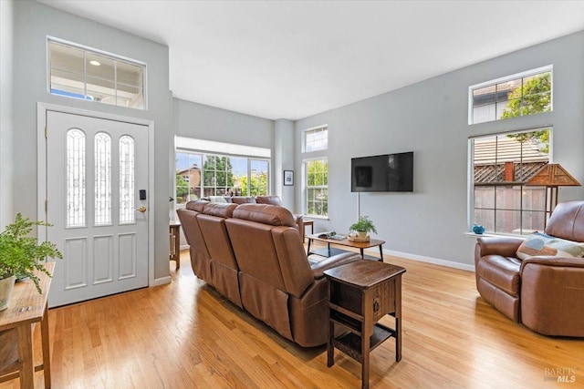 living room with light wood-style floors and baseboards