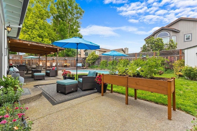 view of patio with a fenced in pool, an outdoor hangout area, and a fenced backyard