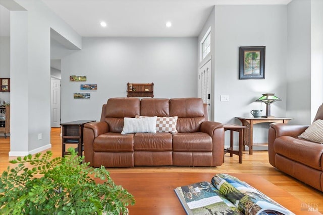 living room with recessed lighting and light wood-style floors