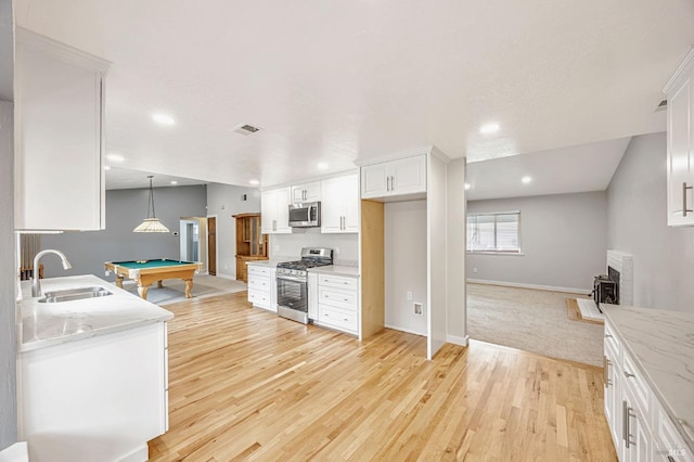 1543 Cunningham Way, Santa Rosa, CA 95403 - kitchen with appliances with stainless steel finishes, a sink, billiards, light wood-style floors, and baseboards