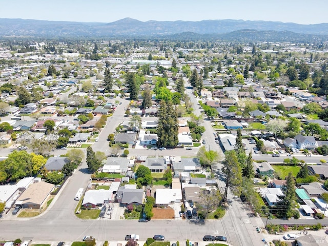 drone / aerial view featuring a mountain view and a residential view