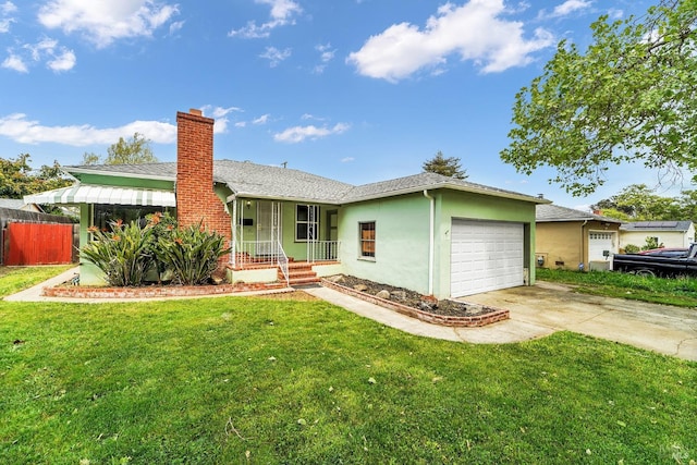 ranch-style house with driveway, a chimney, a front lawn, and a garage