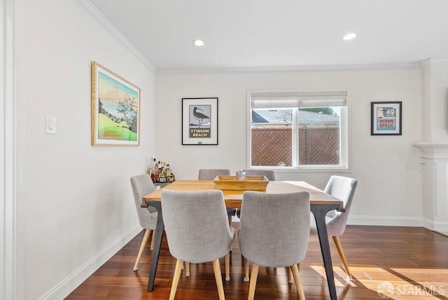 dining space featuring baseboards, ornamental molding, wood finished floors, and recessed lighting