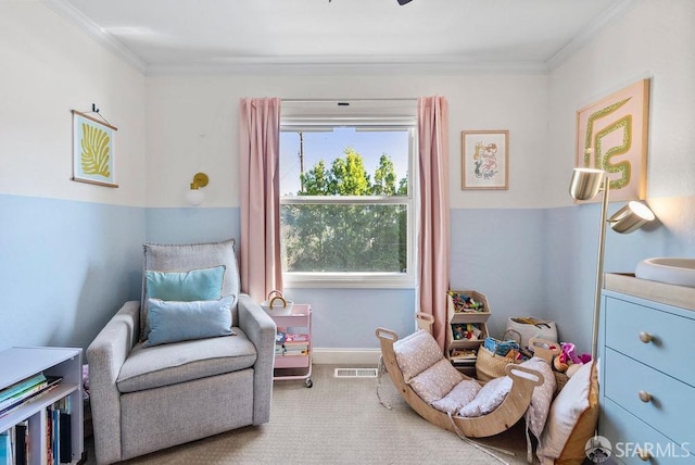 living area with visible vents, crown molding, baseboards, and carpet floors