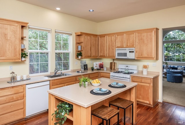 kitchen featuring a sink, light countertops, open shelves, and white appliances