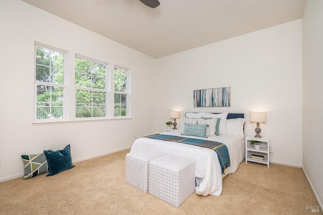 carpeted bedroom featuring a ceiling fan and baseboards