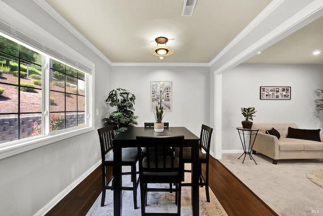 dining space featuring baseboards, dark wood finished floors, and visible vents