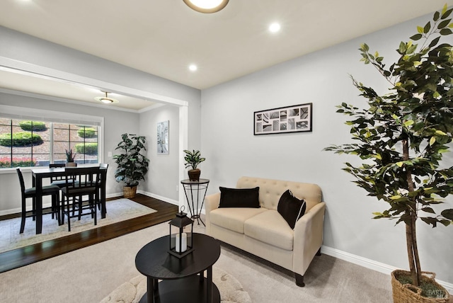 living area featuring recessed lighting, baseboards, and wood finished floors