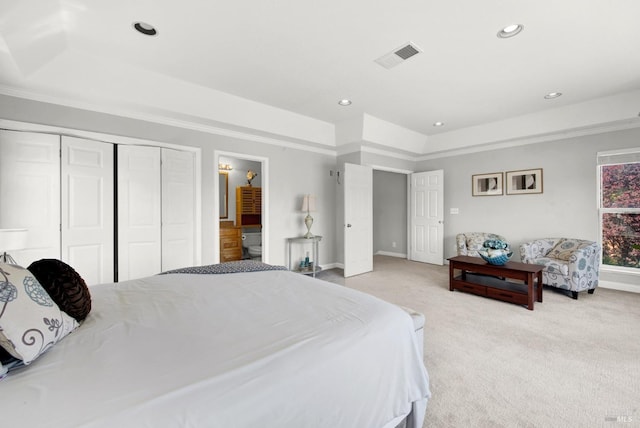 bedroom featuring visible vents, baseboards, a raised ceiling, light carpet, and recessed lighting