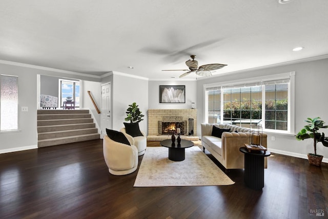 living area featuring baseboards, stairs, wood finished floors, and a wealth of natural light