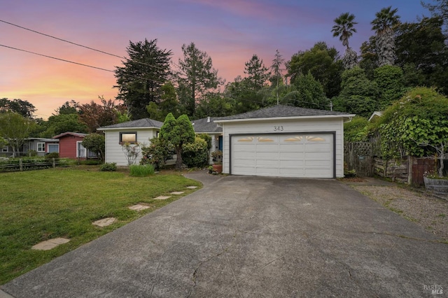 single story home with fence, a front yard, aphalt driveway, and a garage