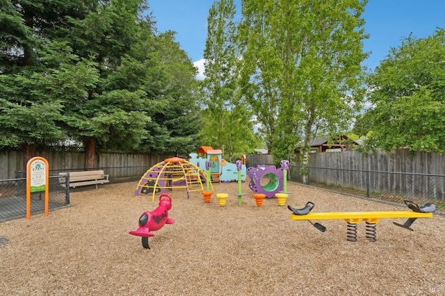 view of jungle gym with fence