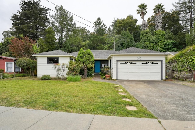 ranch-style house featuring a front yard, an attached garage, and aphalt driveway