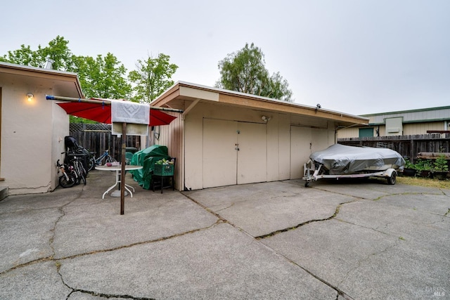 view of outbuilding with fence