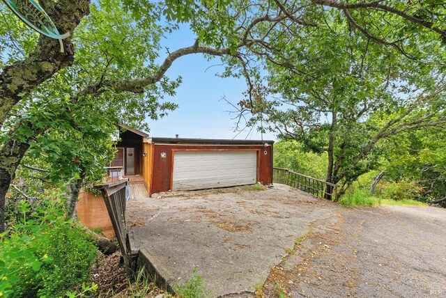 garage featuring driveway