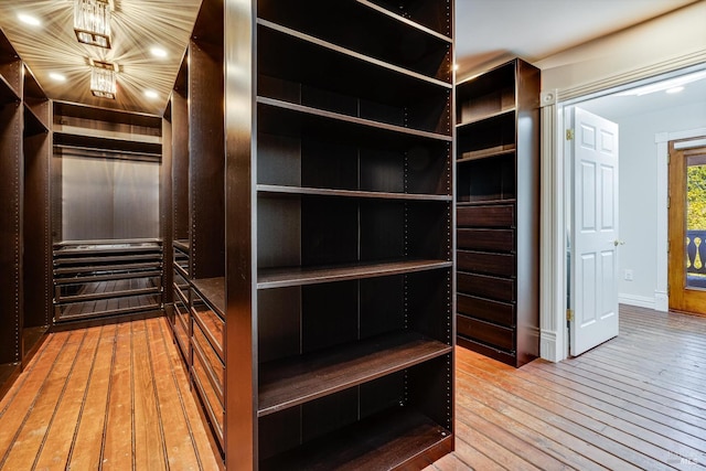 walk in closet featuring hardwood / wood-style floors