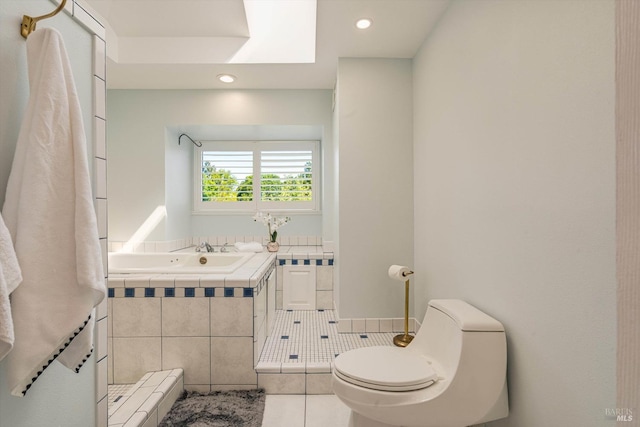 bathroom with a sink, toilet, recessed lighting, a garden tub, and tile patterned flooring