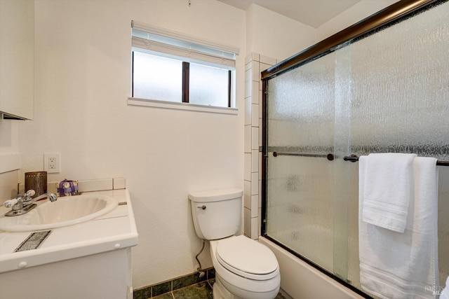 full bathroom featuring vanity, toilet, and enclosed tub / shower combo