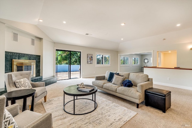 living area with visible vents, carpet flooring, vaulted ceiling, and baseboards