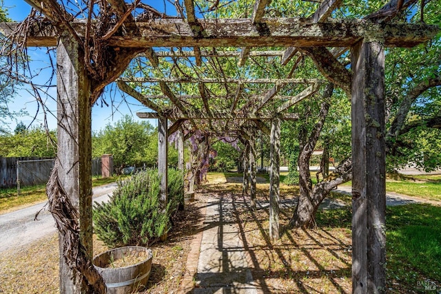 view of patio / terrace with a pergola and fence