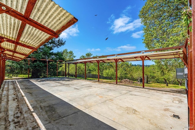 view of patio featuring driveway and a carport
