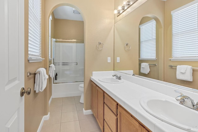 8724 Windsor Rd, Windsor, CA 95492 - bathroom with a sink, tile patterned floors, baseboards, and a healthy amount of sunlight