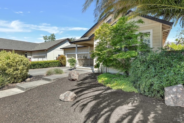 8724 Windsor Rd, Windsor, CA 95492 - single story home with an attached garage, board and batten siding, and driveway