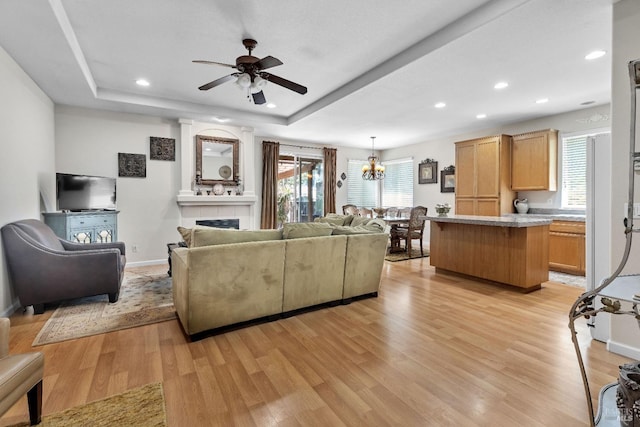 8724 Windsor Rd, Windsor, CA 95492 - living area featuring a healthy amount of sunlight, recessed lighting, ceiling fan with notable chandelier, and light wood-type flooring